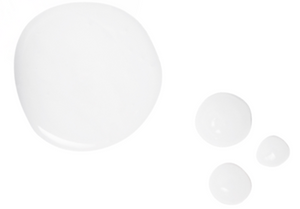 White round pumps of skincare formula on a white background